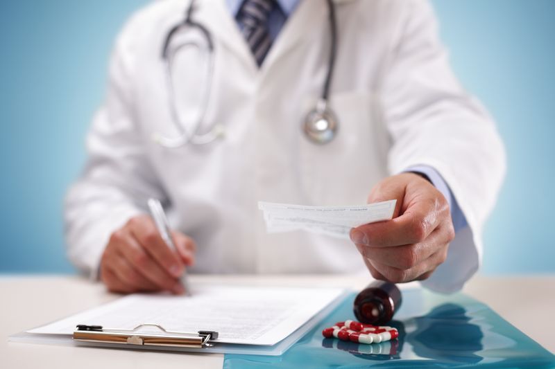 Pharmacist reviewing prescription information